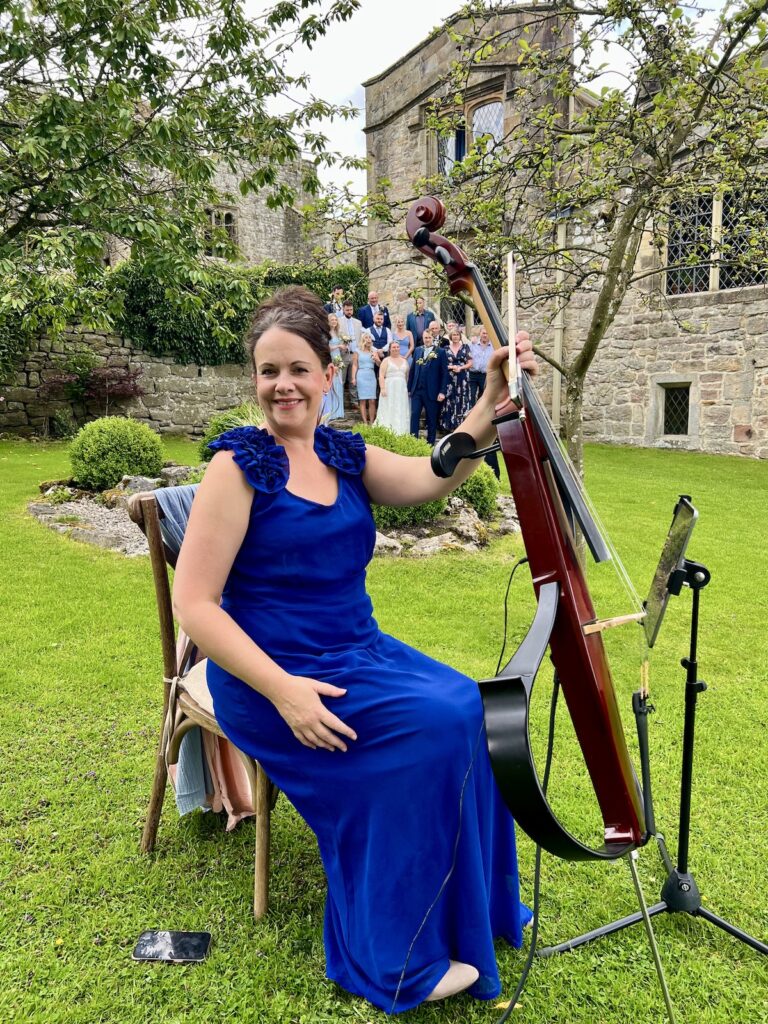 Wedding Cellist in Yorkshire outside Barden Tower