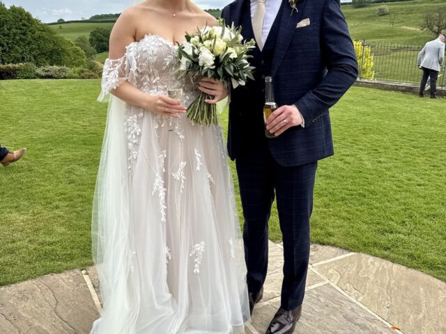 Bride and Groom outside at Kingscote Barn in the Cotswolds