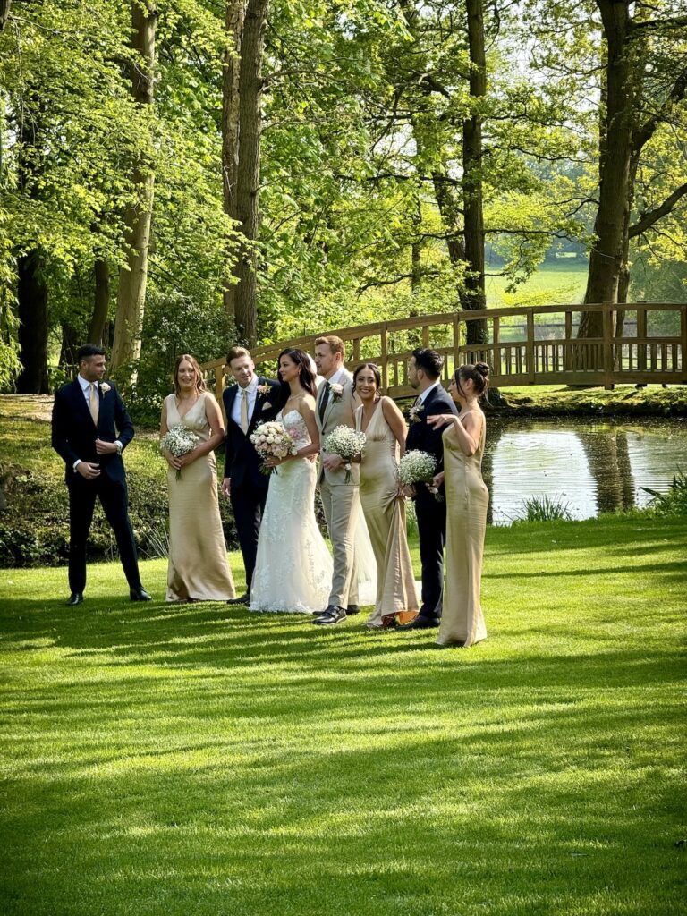 Bride and Groom with Bridesmaids at Mulberry House in Essex