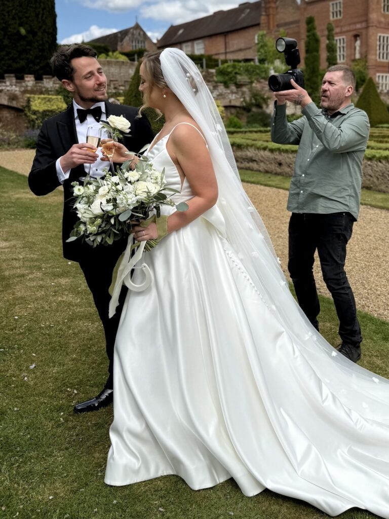 Bride and Groom being photographed at Oxnead Hall in Norfolk
