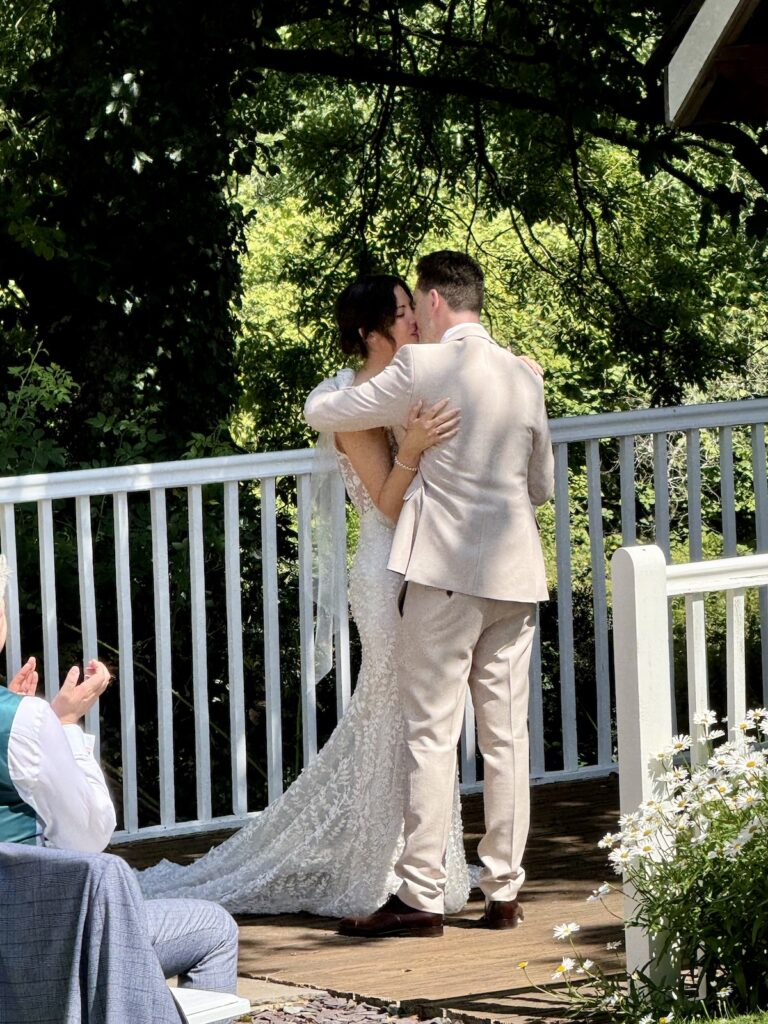 Wedding first kiss outside