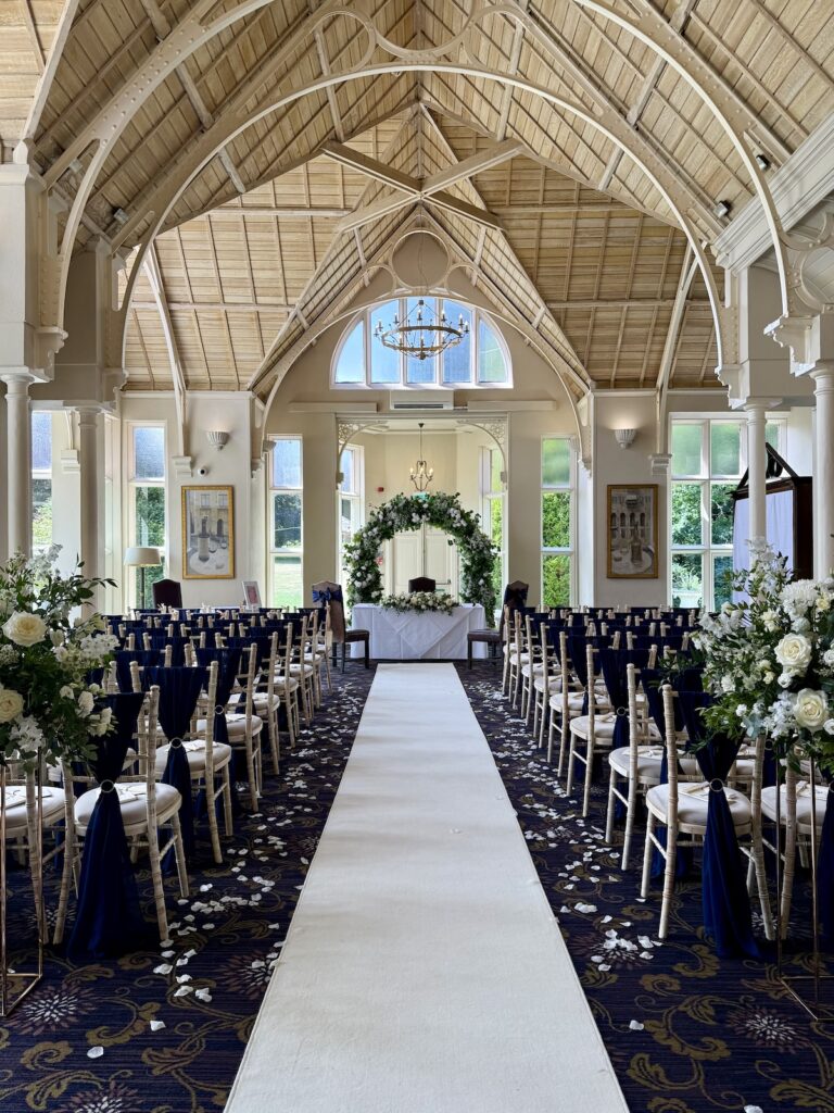 Aisle walk with flowers at Audleys Wood Hotel in Basingstoke.