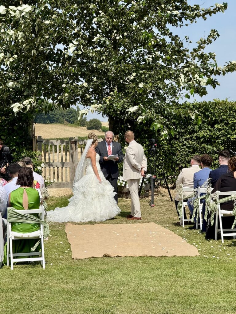 Bride and Groom outdoor ceremony at Charingworth Manor in the Cotswolds