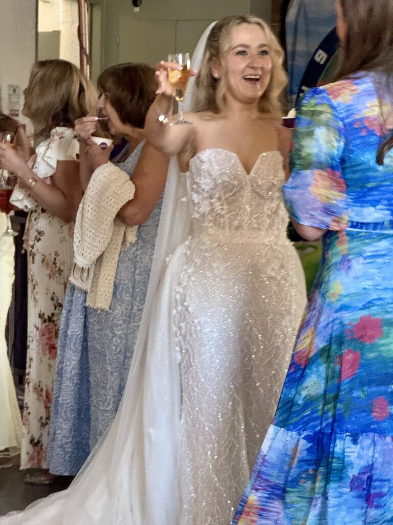 Bride in the drinks reception at the West Mill Wedding Venue in Derby