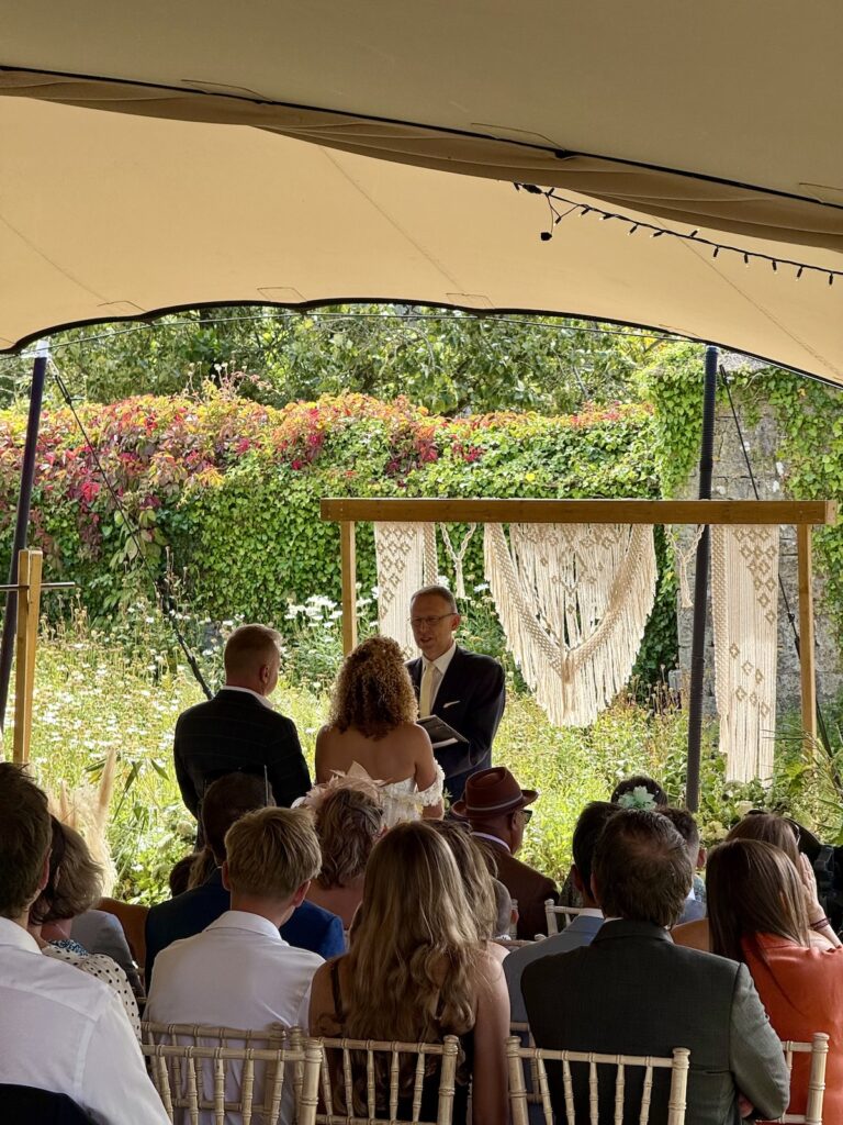 Wedding couple outside ceremony at the Ash Barton Estate in North Devon