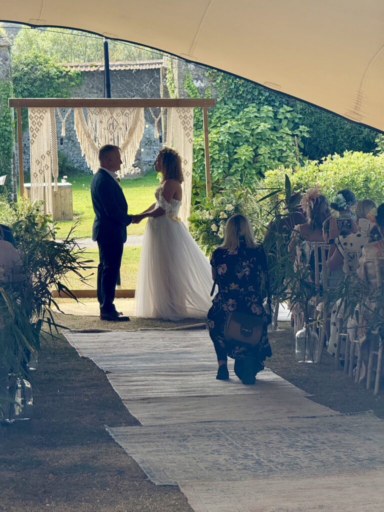 Wedding ceremony bride and groom outside at the Ash Barton Estate in North Devon