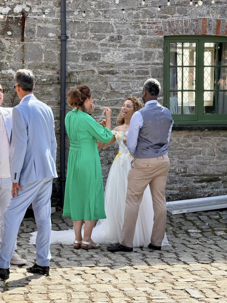 Bride laughing and smiling at the Ash Barton Estate in North Devon