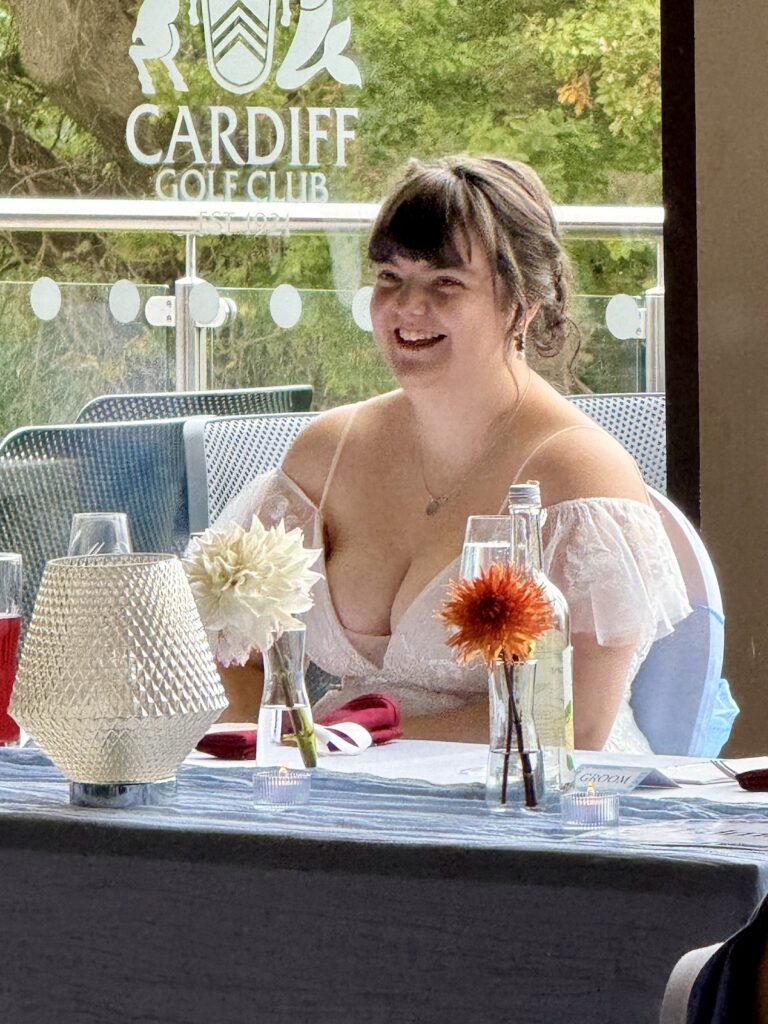 Bride smiling at Cardiff Golf Club in South Wales.