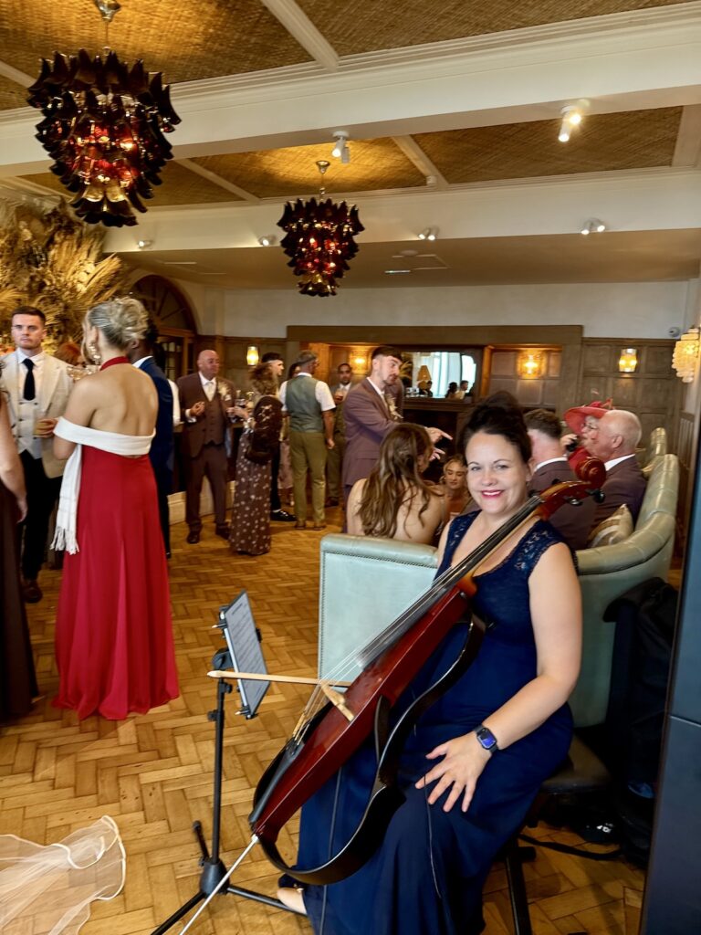 Anne Marie Wedding Cellist for JAM Duo in the drinks reception at Grand Villa Heights in Ravenscar