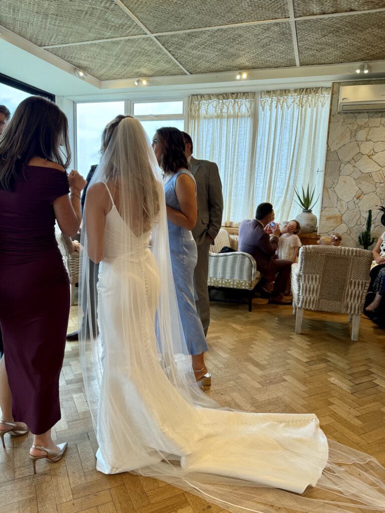 Bride in the drinks reception at Grand Villa Heights in Ravenscar