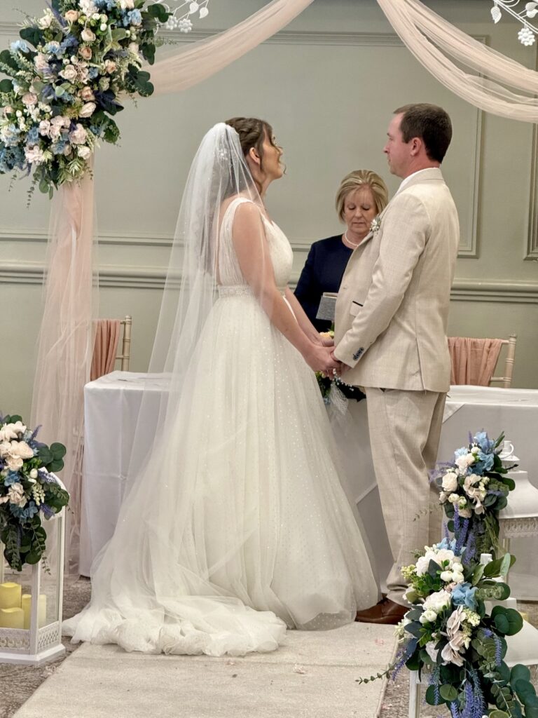 Bride and groom at the altar with registrar at Hellaby Hall Hotel