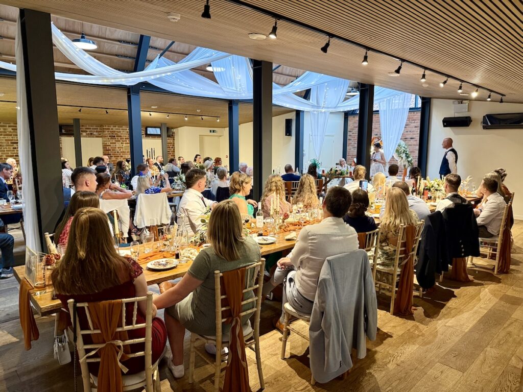 Wedding meal with brides giving speeches at the Pheasantry Brewery near Newark in Nottinghamshire.
