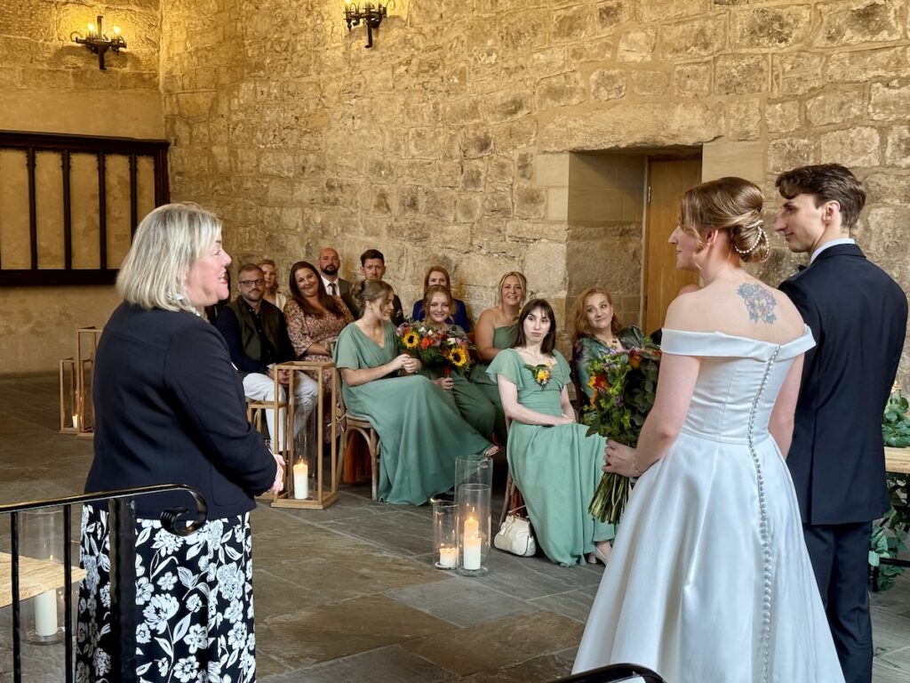 Wedding couple with registrar at the Priests House in Skipton