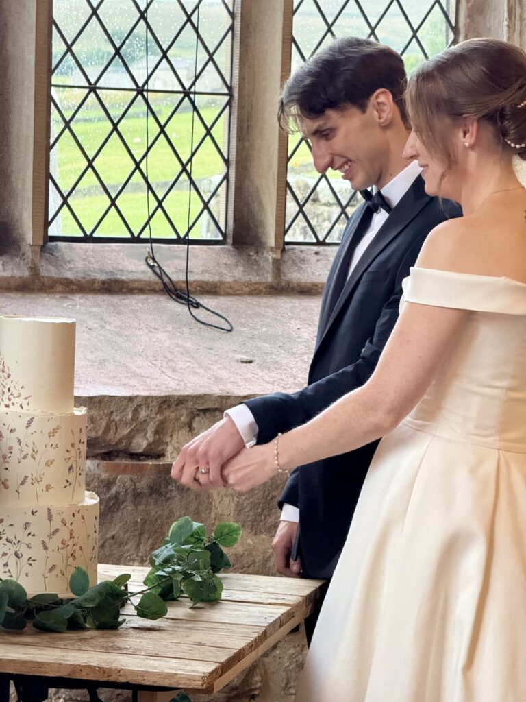 Cutting a wedding cake at the Priests House in Skipton