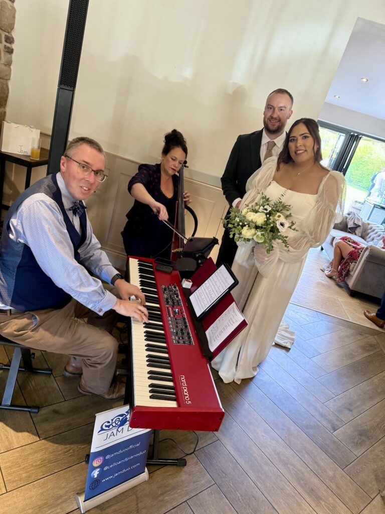 JAM Duo with bride and groom at Stretton Manor Barns