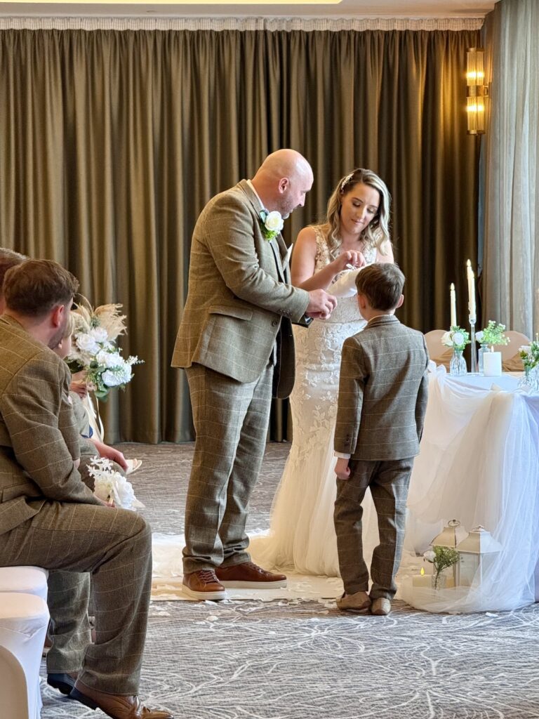 Bride and Groom with ring bearer at The Grand in Southport near Liverpool.