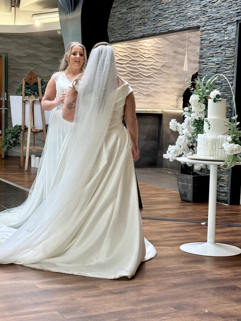 Two brides with wedding cake at The Vu in Bathgate Scotland