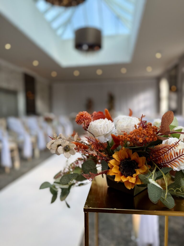 Orange florals for wedding at Balbirnie House in Scotland