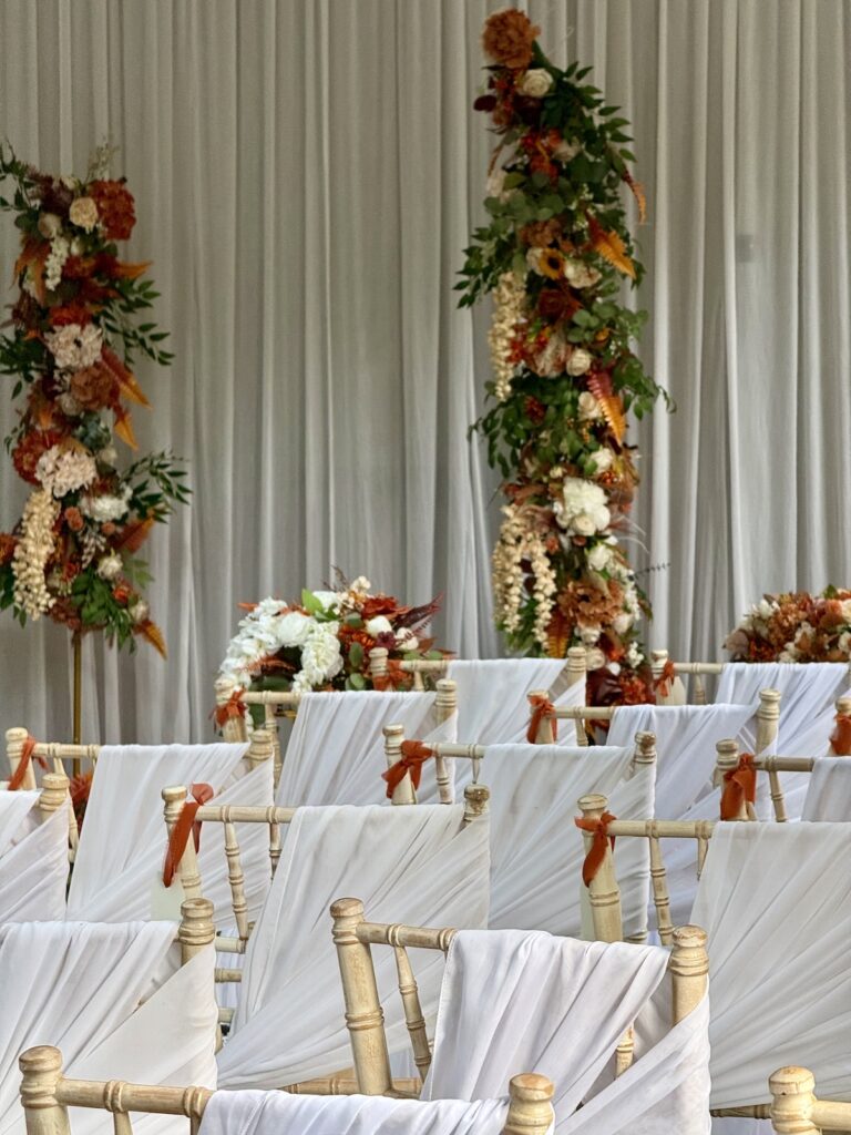 Ceremony Chairs and floral arch in orange colours at Balbirnie House in Scotland