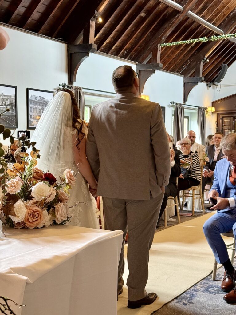 Bride and Groom ready to exit the ceremony at Dunstan Hall Hotel in Norwich, Norfolk