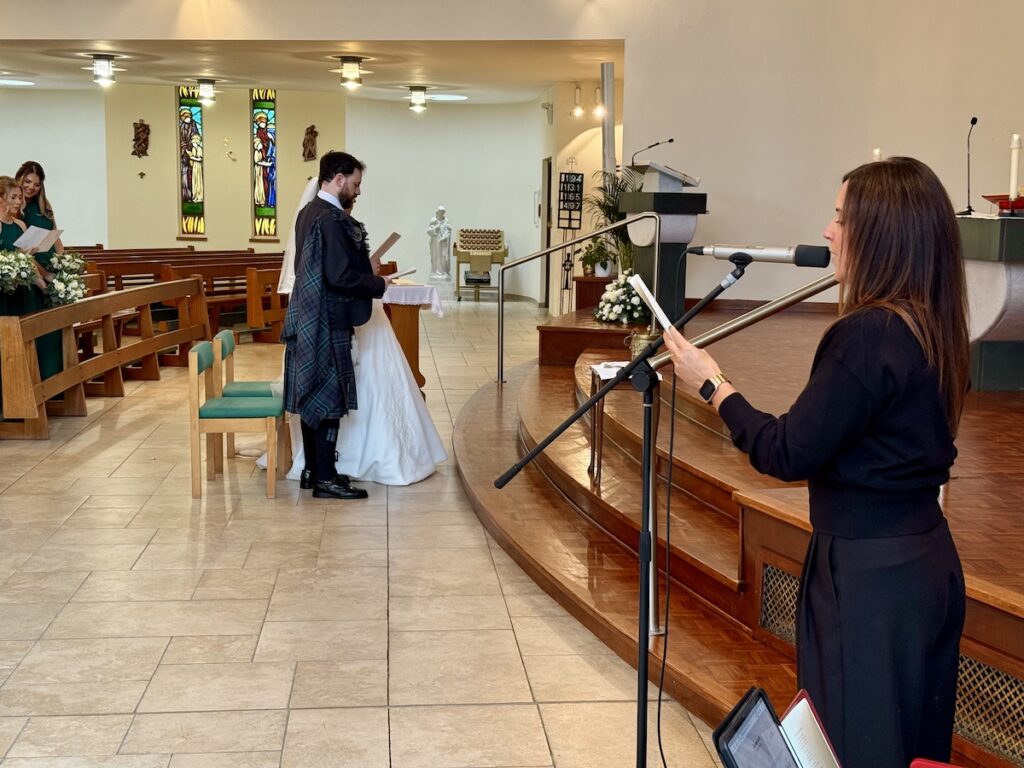 Bride and Groom with singer at St Joseph's RC Church in Clarkston, Glasgow, Scotland