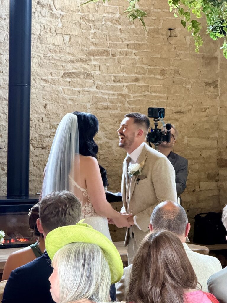 Couple during wedding ceremony at Old Gore in Cirencester.