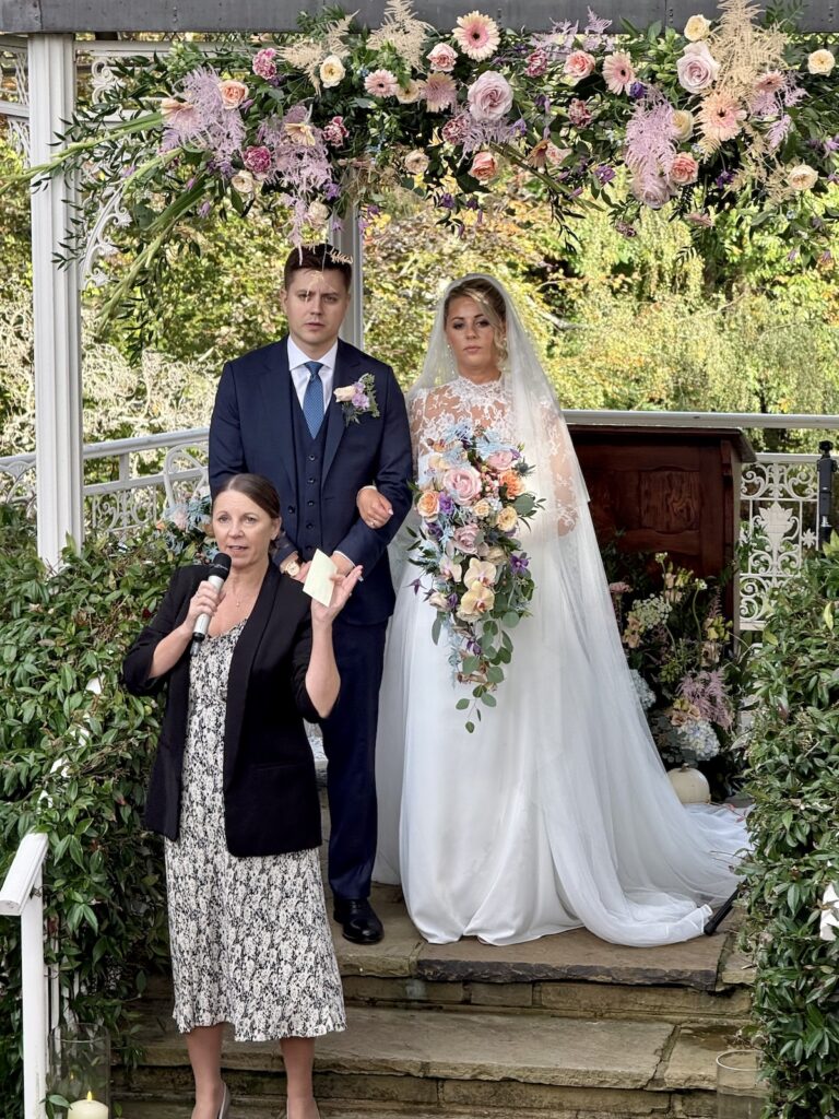 Bride and Groom with registrar at Pennyhill Park