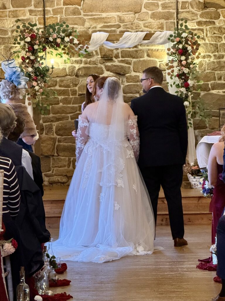 Bride walking down the aisle to live Canon in D at Danby Castle

