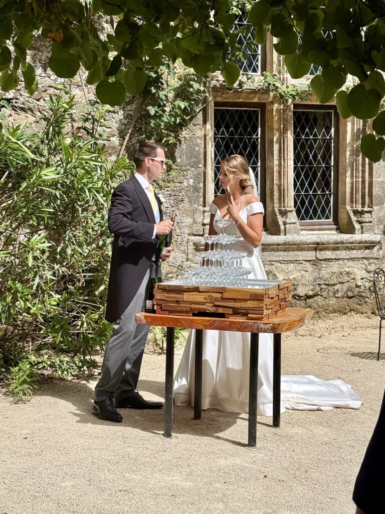 Champagne tower during a destination wedding reception at Château de Chanzé.