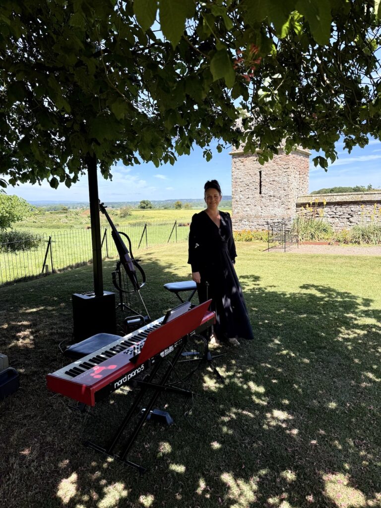 Anne Marie Humphries Wedding cellist with cello and piano at Rowton Castle with daytime wedding music by JAM Duo