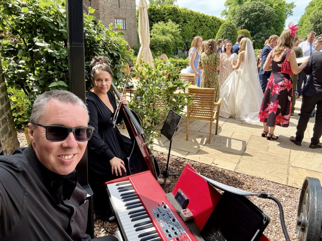 JAM Duo on the terrace at Rowton Castle with daytime wedding music by JAM Duo