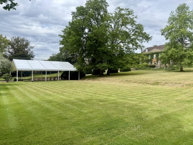 Outside wedding ceremony in the gardens at Cornwell Manor in the Cotswolds with daytime music by JAM Duo, Cello and Piano