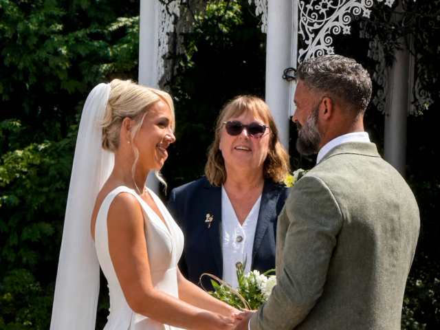 Bride and groom during ceremony with registrar at Bowburn Hall Hotel in Durham