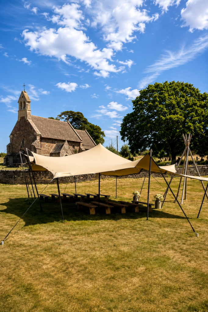 Rustic stretch tent prepared for an outdoor wedding ceremony in Herefordshire