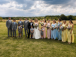 Hannah and Gary with their wedding party in the countryside at Stretton Manor Barn near Chesterfield
