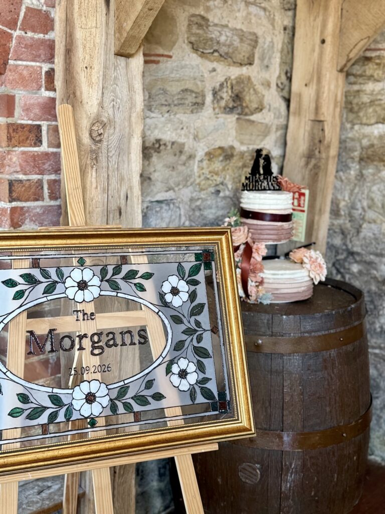 Wedding cake and welcome sign in East Sussex