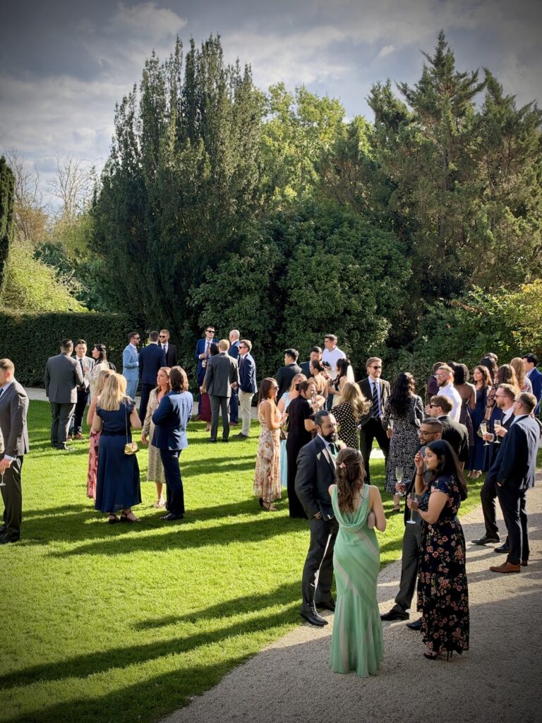 Drinks reception in the afternoon sun at Elmore Court in Gloucestershire