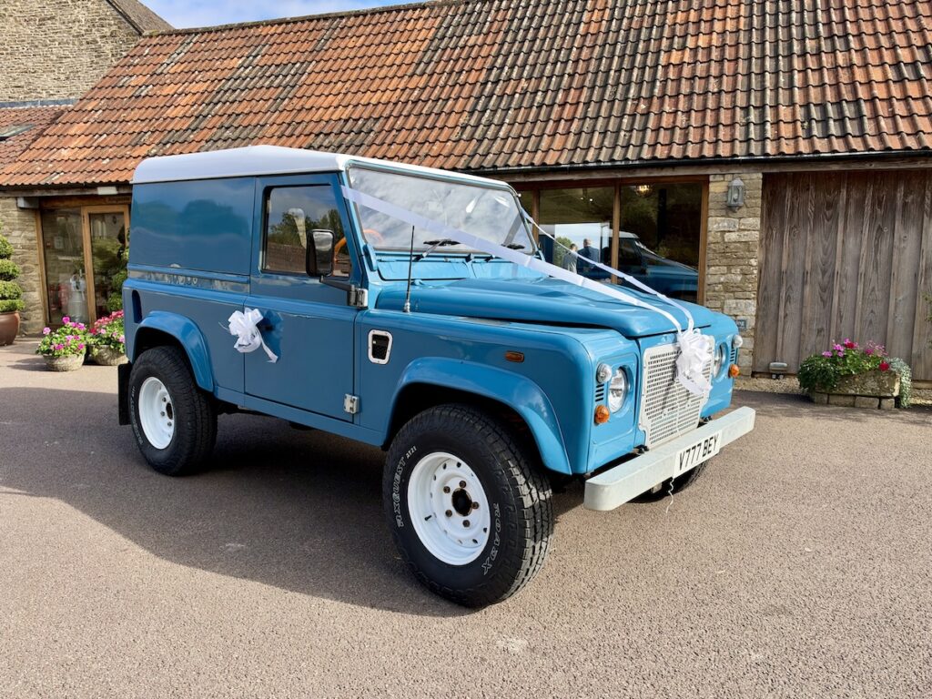 Blue Landrover Defender 90 at Kingscote barn in The Cotswolds