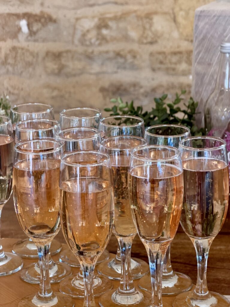 Champagne at Kingscote barn in The Cotswolds